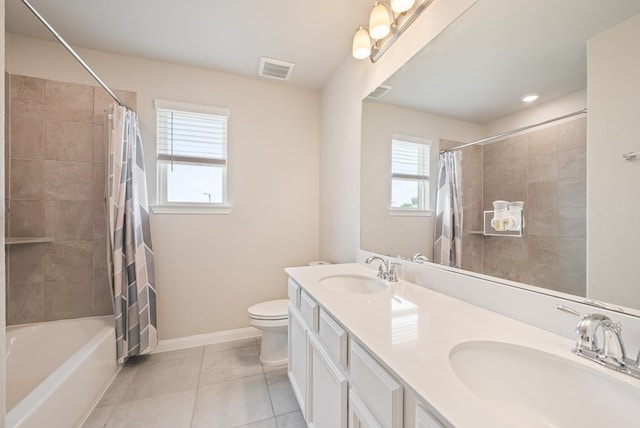 full bathroom featuring a sink, tile patterned floors, toilet, and visible vents