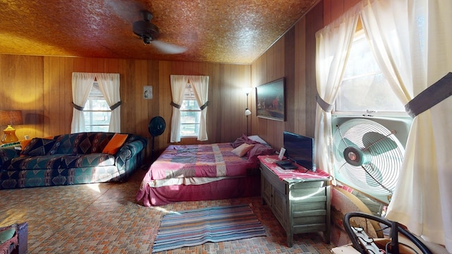 bedroom featuring wooden walls