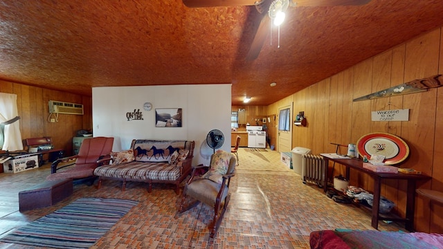 living room with wood walls and a wall mounted air conditioner