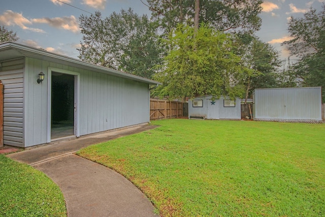 yard at dusk with an outbuilding