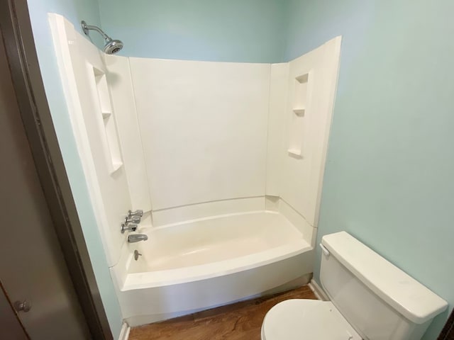 bathroom with toilet and shower / tub combination