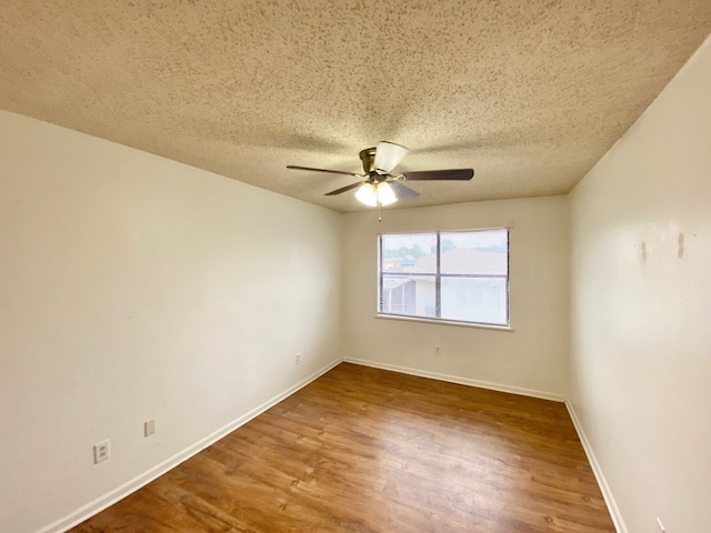 unfurnished room featuring ceiling fan, a textured ceiling, and hardwood / wood-style flooring