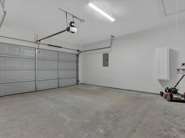 garage with a garage door opener and electric panel