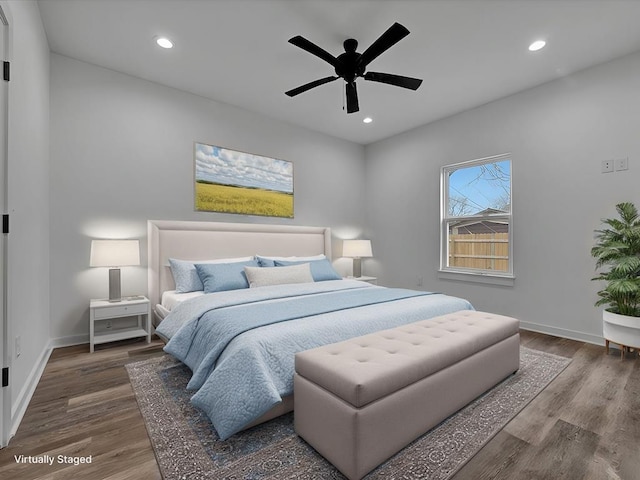 bedroom featuring hardwood / wood-style flooring and ceiling fan