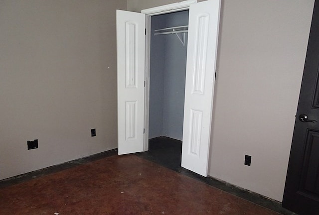 unfurnished bedroom with a closet