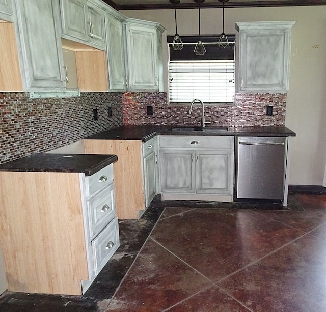 kitchen with stainless steel dishwasher, backsplash, dark tile patterned floors, and sink