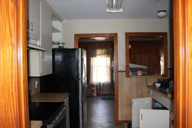 kitchen featuring electric range and under cabinet range hood