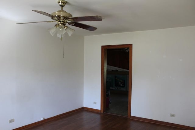 unfurnished room featuring a ceiling fan, baseboards, and wood finished floors