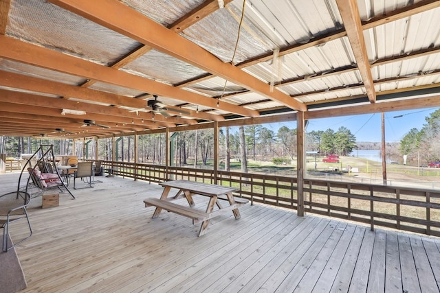 wooden deck with ceiling fan and outdoor dining area