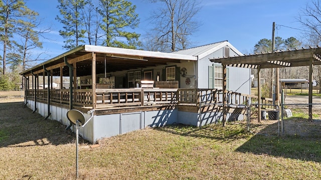 exterior space with a lawn and a pergola