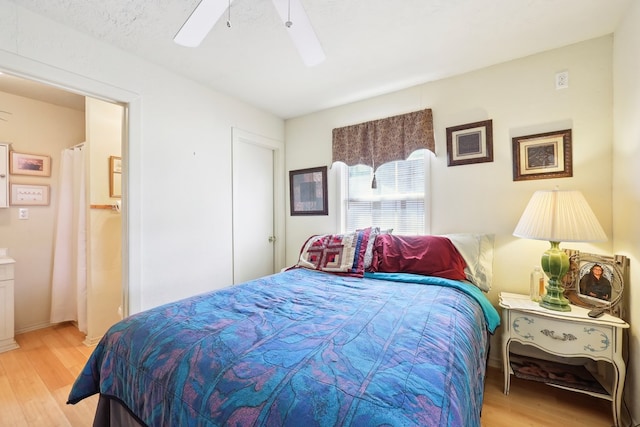 bedroom with a ceiling fan and light wood finished floors