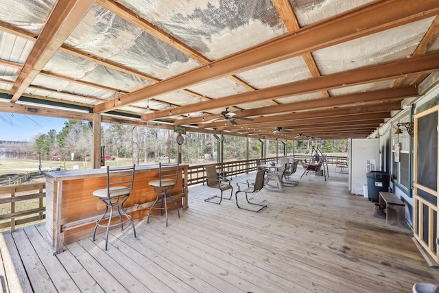 wooden deck featuring a ceiling fan