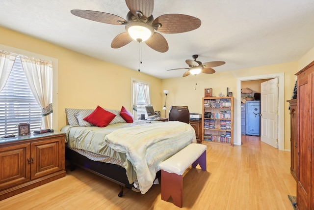 bedroom featuring light wood-style flooring and a ceiling fan