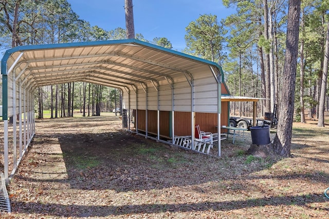 view of parking / parking lot featuring a detached carport