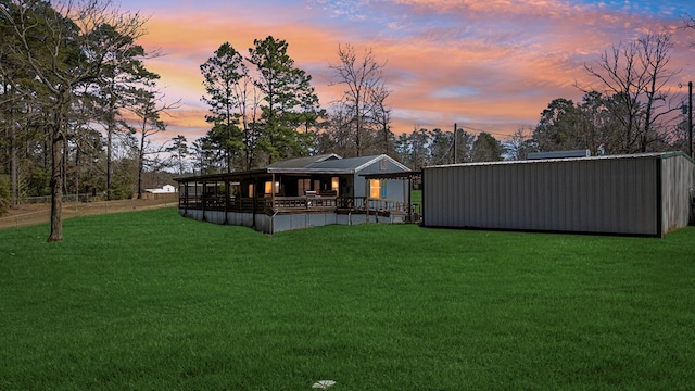 view of yard at dusk