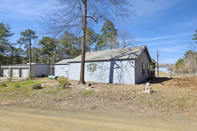 view of outbuilding with an outbuilding and fence