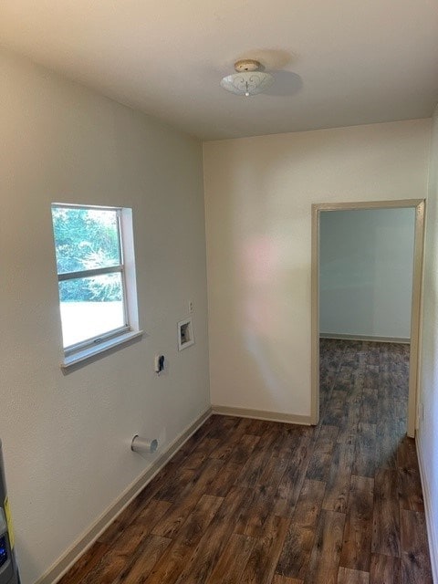 washroom with dark hardwood / wood-style floors and hookup for a washing machine