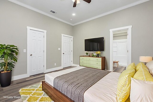 121 Kerr Ave, Lufkin, TX 75904 - bedroom with wood finished floors, crown molding, baseboards, ensuite bathroom, and a ceiling fan