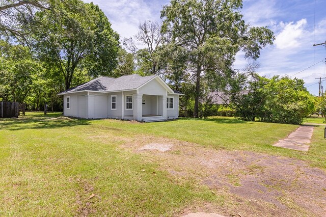 121 Kerr Ave, Lufkin, TX 75904 - view of grassy yard with a porch