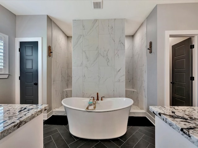 bathroom featuring tile patterned flooring, vanity, and independent shower and bath