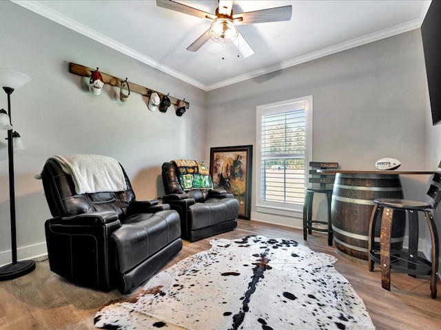 interior space with hardwood / wood-style floors, ceiling fan, and crown molding