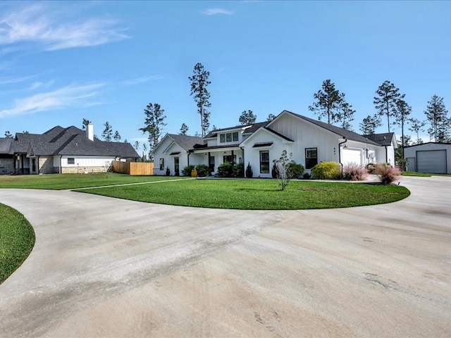 view of front of house with a garage and a front lawn