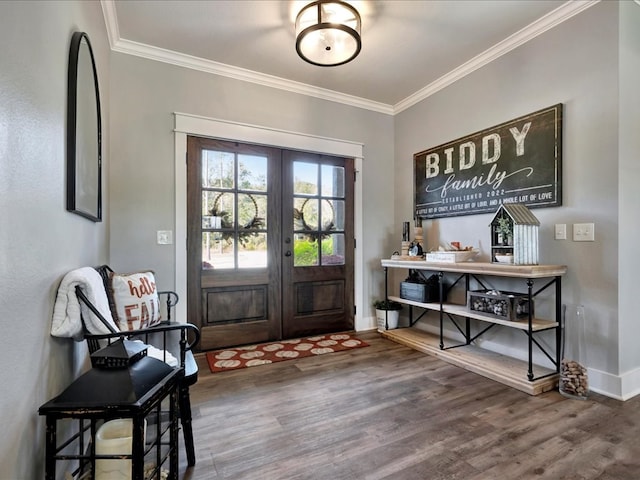 entryway with crown molding, hardwood / wood-style floors, and french doors