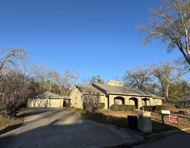 view of front of home featuring an outbuilding and a garage