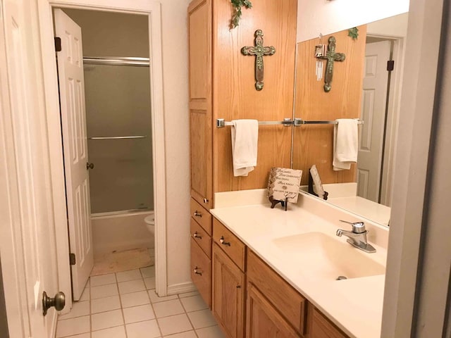 full bathroom with tile patterned floors, vanity, toilet, and shower / bath combination with glass door