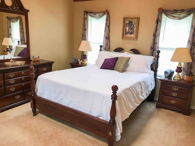 bedroom with light colored carpet