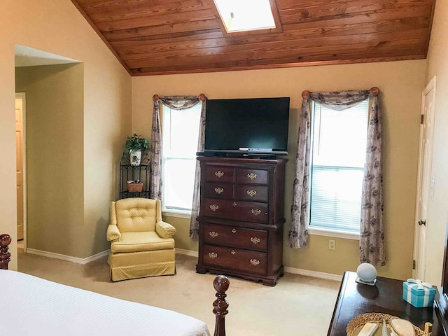 bedroom with lofted ceiling with skylight, light colored carpet, and wooden ceiling