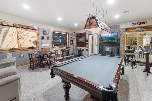 playroom featuring a fireplace and pool table