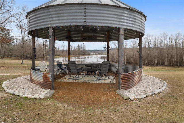 exterior space featuring a water view and a gazebo