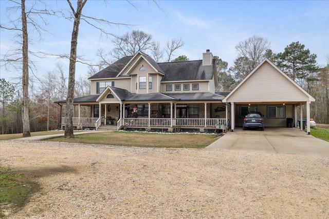 view of front of home featuring covered porch and a carport