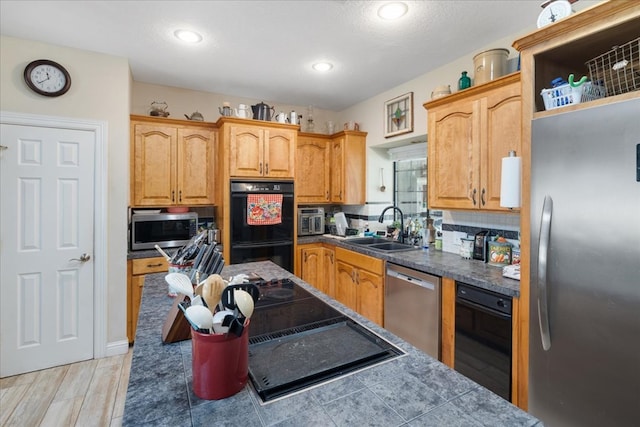 kitchen with stainless steel appliances, light hardwood / wood-style floors, backsplash, sink, and wine cooler