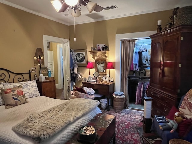 bedroom with crown molding and ceiling fan