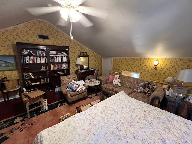 bedroom featuring lofted ceiling, ceiling fan, and carpet