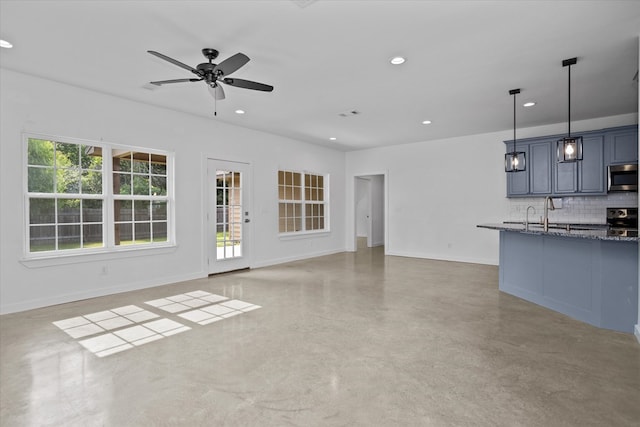 174 Cedar Hill Loop, Lufkin, TX 75904 - unfurnished living room featuring a ceiling fan, recessed lighting, concrete floors, and baseboards