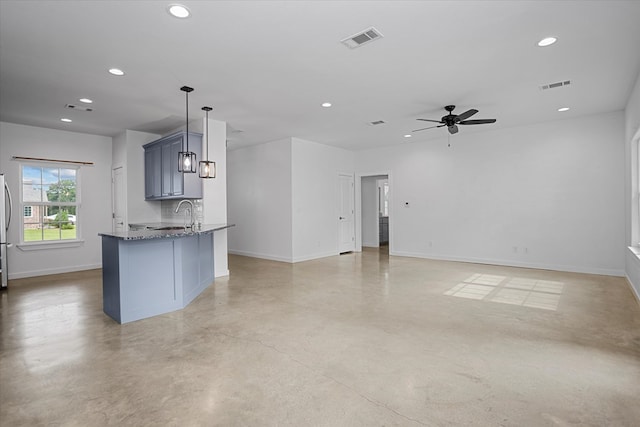 174 Cedar Hill Loop, Lufkin, TX 75904 - kitchen featuring recessed lighting, baseboards, stone counters, finished concrete flooring, and a ceiling fan