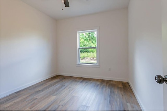 spare room with ceiling fan and light hardwood / wood-style flooring