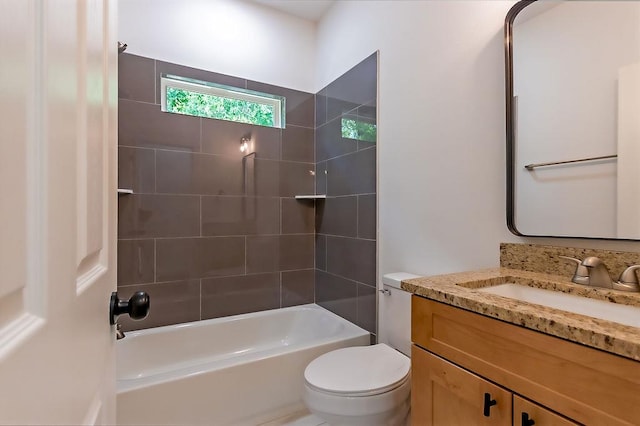 full bathroom featuring vanity, toilet, and tiled shower / bath