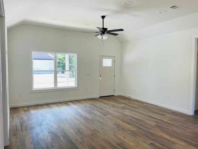 interior space with lofted ceiling, ceiling fan, and dark wood-type flooring