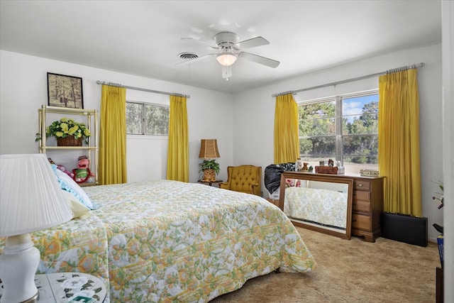 bedroom with light colored carpet and ceiling fan