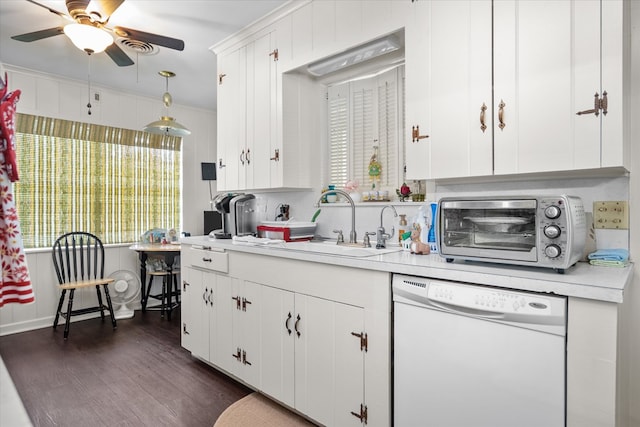 kitchen featuring dark hardwood / wood-style flooring, sink, decorative light fixtures, dishwasher, and white cabinetry