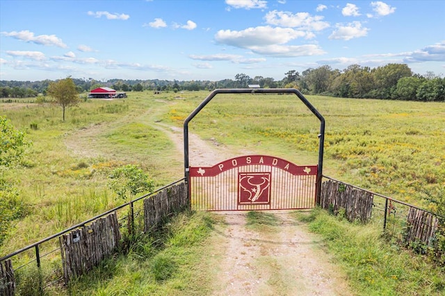 view of gate featuring a rural view