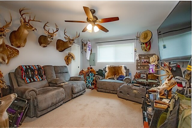 carpeted living room featuring electric panel and ceiling fan