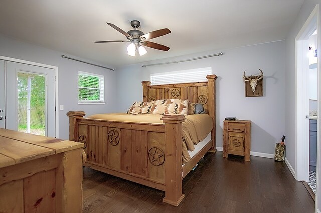 bedroom featuring ceiling fan, dark wood-type flooring, access to outside, and multiple windows