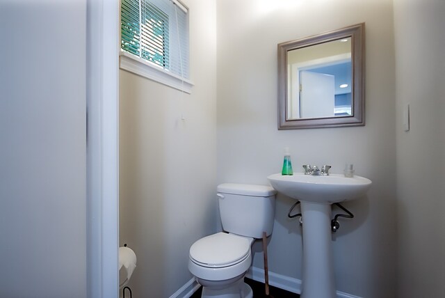 bathroom with toilet and sink