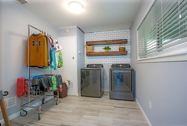 laundry room featuring washing machine and dryer