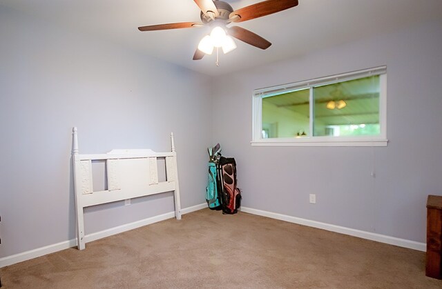 empty room featuring light carpet and ceiling fan